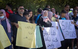 A protest against the 'family reunification law' outside the Knesset, in Jerusalem, on June 29, 2021. (Yonatan Sindel/Flash90)