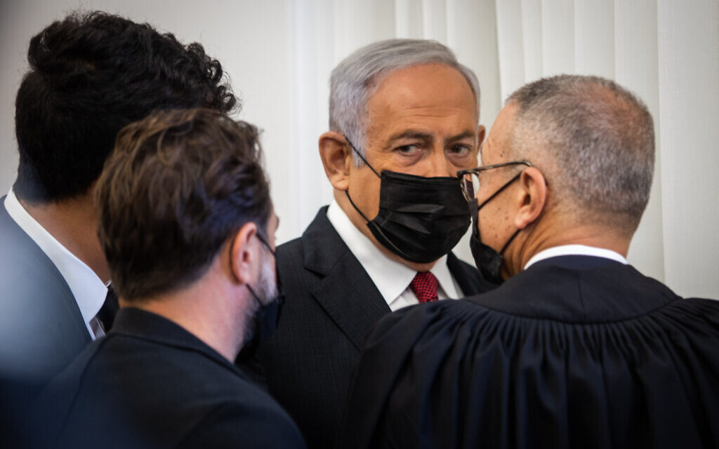 Former prime minister Benjamin Netanyahu arrives at the Jerusalem District Court for a hearing in his ongoing corruption trial, on November 22, 2021. (Oren Ben Hakoon/Pool) Former prime minister Benjamin Netanyahu arrives at the Jerusalem District Court for a hearing in his ongoing corruption trial, on November 22, 2021. (Oren Ben Hakoon/Pool)