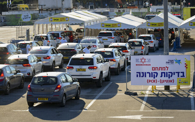 Cars line up at a drive-through COVID-19 testing center at Expo Tel Aviv, January 3, 2022. (Avshalom Sassoni/Flash90) Cars line up at a drive-through COVID-19 testing center at Expo Tel Aviv, January 3, 2022. (Avshalom Sassoni/Flash90)
