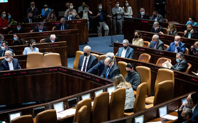 Illustrative: Ministers and MKs attend a plenum session in the assembly hall of the Knesset in Jerusalem, January 5, 2022.(Yonatan Sindel/Flash90) Illustrative: Ministers and MKs attend a plenum session in the assembly hall of the Knesset in Jerusalem, January 5, 2022.(Yonatan Sindel/Flash90)