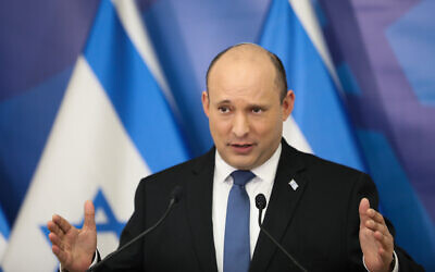 Prime Minister Naftali Bennett holds a press conference on the Omicron outbreak, at the Kirya military base in Tel Aviv, on January 11, 2022. (Noam Revkin Fenton/Flash90)