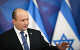 Prime Minister Naftali Bennett holds a press conference at the Kirya military base in Tel Aviv, January 11, 2022. (Noam Revkin Fenton/Flash90)
