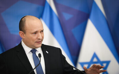 Prime Minister Naftali Bennett holds a press conference in Tel Aviv on January 11, 2022. (Noam Revkin Fenton/Flash90)