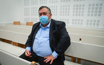 Likud MK David Bitan arrives for a court hearing at the Lod District Court, on January 19, 2022. (Avshalom Sassoni/Flash90)