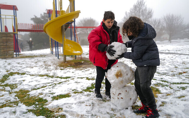 Snow in Kibbutz Ein Zivan, in the northern Golan Heights, January 26, 2022. (Michael Giladi/Flash90) Snow in Kibbutz Ein Zivan, in the northern Golan Heights, January 26, 2022. (Michael Giladi/Flash90)