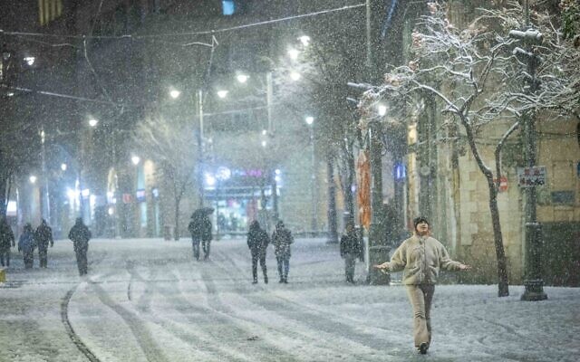 Snow falls on Jaffa street in Jerusalem, as a heavy storm hits nationwide, January 26, 2022. (Yonatan Sindel/Flash90) Snow falls on Jaffa street in Jerusalem, as a heavy storm hits nationwide, January 26, 2022. (Yonatan Sindel/Flash90)