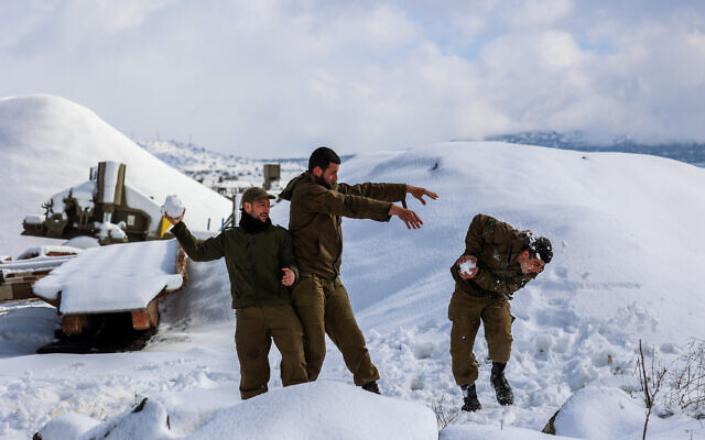 Israeli soldiers in the snow-covered Golan Heights, in northern Israel, after a heavy storm hit the nation, January 27, 2022. (Maor Kinsbursky/Flash90) Israeli soldiers in the snow-covered Golan Heights, in northern Israel, after a heavy storm hit the nation, January 27, 2022. (Maor Kinsbursky/Flash90)