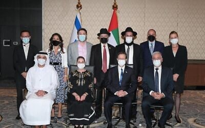 President Isaac Herzog meets representatives of the Jewish community in the UAE, Janaury 30, 2022. Top row (right to left): Yifat Turbiner, Steve Benchimol, Rabbi Levi Duchman, Rabbi Eli Abadi, Daniel Seal, Sarah Benchimol, and Ross Kriel. Bottom row (right to left): Israeli Ambassador in the UAE Amir Hayek, President Isaac Herzog, First Lady Michal Herzog, UAE Ambassador in Israel Mohamed Al Khaja. (Amos Ben Gershom/GPO)