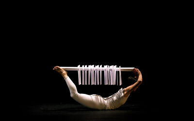 Hila Ben Ari's dancers play with paper and movement in her video homage to papercut artist Moshe Reifer, a fellow member of Kibbutz Yagur in her childhood, currently on exhibit at Ticho House through October 2022. (Courtesy Ticho House)