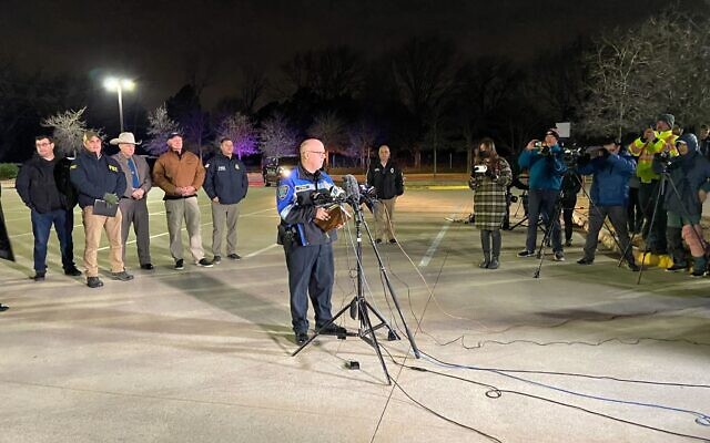 Colleyville Police Chief Mike Miller addresses reporters at a staging area near Congregation Beth Israel on January 15, 2022. (Jacob Magid/Times of Israel) Colleyville Police Chief Mike Miller addresses reporters at a staging area near Congregation Beth Israel on January 15, 2022. (Jacob Magid/Times of Israel)