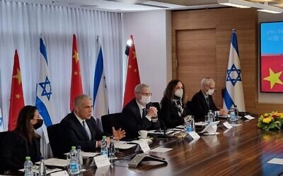 Then-foreign minister Yair Lapid (second from left) speaks at the Fifth Israel-China Joint Committee on Innovation meeting, January 24, 2022. (MFA)