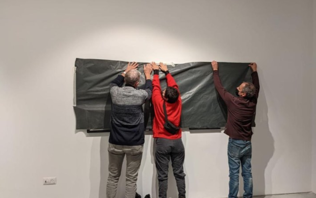 Artists covering their artworks in December 2021 protest over a feud regarding a controversial painting at a Ramat Gan museum (Courtesy David Reeb Instagram) Artists covering their artworks in December 2021 protest over a feud regarding a controversial painting at a Ramat Gan museum (Courtesy David Reeb Instagram)