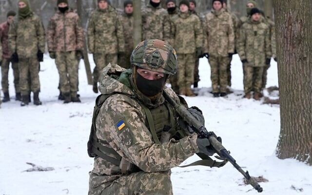 An instructor trains members of Ukraine's Territorial Defense Forces, volunteer military units, in a city park in Kyiv, Ukraine, January 22, 2022. (AP Photo/Efrem Lukatsky) An instructor trains members of Ukraine's Territorial Defense Forces, volunteer military units, in a city park in Kyiv, Ukraine, January 22, 2022. (AP Photo/Efrem Lukatsky)