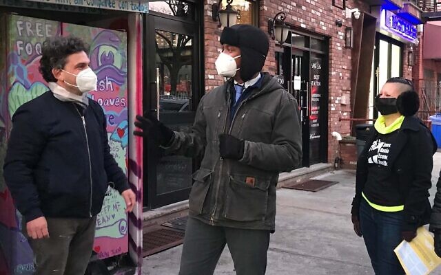 NYC Councilmembers Lincoln Restler and Chi Ossé speak to members of Jews for Racial & Economic Justice, who were in Williamsburg, Brooklyn to canvas passersby and offer tips on how to defuse antisemitic and other bigoted incidents, January 4, 2022. (Julia Gergely/JTA)