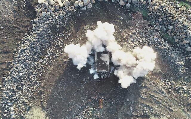 Hundreds of pieces of ordnance that were abandoned in a Syrian bunker following the 1967 Six Day War are detonated in a controlled explosion on January 2, 2021. (Defense Ministry) Hundreds of pieces of ordnance that were abandoned in a Syrian bunker following the 1967 Six Day War are detonated in a controlled explosion on January 2, 2021. (Defense Ministry)