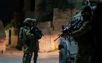IDF soldiers operating in the West Bank Palestinian town of Silat al-Harithiya, December 20, 2021. (Israel Defense Forces) IDF soldiers operating in the West Bank Palestinian town of Silat al-Harithiya, December 20, 2021. (Israel Defense Forces)