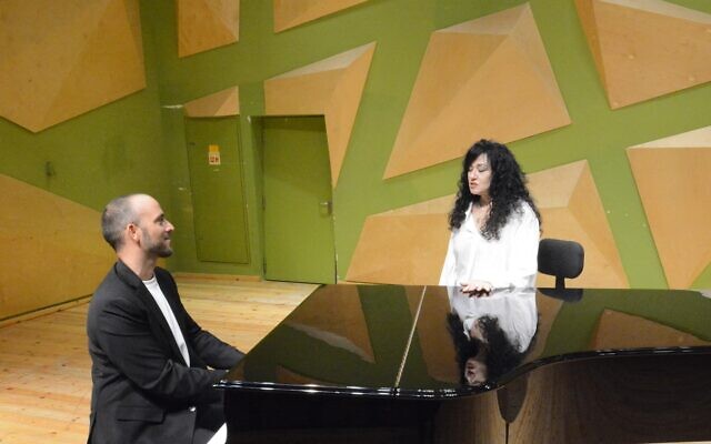 Composer and conductor Tomer Adaddi with singer Shlomit Aharon during their duet for 'Singing with the Composer,' Addadi's 2022 program that puts him at the front of the stage (Courtesy Tomer Addadi) Composer and conductor Tomer Adaddi with singer Shlomit Aharon during their duet for 'Singing with the Composer,' Addadi's 2022 program that puts him at the front of the stage (Courtesy Tomer Addadi)