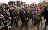 Border Police officers try to disperse Palestinians and activists gathering to demonstrate in the flashpoint neighborhood of Sheikh Jarrah in east Jerusalem, February 18, 2022. (Ronaldo Schemidt/AFP)
