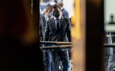 Ukrainian President Volodymyr Zelensky walks into the Bayerischer Hof Hotel after meeting with the US Vice President at the Munich Security Conference (MSC) in Munich, southern Germany, on February 19, 2022. (Andrew Harnik/Pool/AFP)