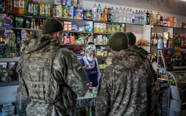 Ukraine's Military Forces servicemen shop in the Donetsk region town of Avdiivka, on the eastern Ukraine front-line with Russia-backed separatists on February 21, 2022. (Aleksey Filippov / AFP) Ukraine's Military Forces servicemen shop in the Donetsk region town of Avdiivka, on the eastern Ukraine front-line with Russia-backed separatists on February 21, 2022. (Aleksey Filippov / AFP)