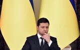 Ukrainian President Volodymyr Zelensky attends a joint press conference with his counterparts from Lithuania and Poland following their talks in Kyiv on February 23, 2022. (SERGEI SUPINSKY / AFP)