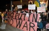 Demonstrators protest Russia's invasion of Ukraine in the Studio City neighborhood of Los Angeles, California on February 24, 2022. (Robyn Beck / AFP)