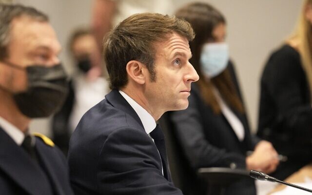 French President Emmanuel Macron attends a video conference with other leaders of NATO nations members at the French Army headquarters in Paris, on February 25, 2022 (Michel Euler/Pool/AFP)