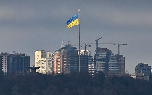 Ukraine's biggest national flag flies in Kyiv, on February 26, 2022 (Genya Savilov/AFP)