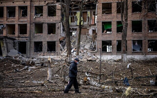 A man walks in front of a destroyed building after a Russian missile attack in the town of Vasylkiv, near Kyiv, on February 27, 2022 (Dimitar Dilkoff/AFP) A man walks in front of a destroyed building after a Russian missile attack in the town of Vasylkiv, near Kyiv, on February 27, 2022 (Dimitar Dilkoff/AFP)