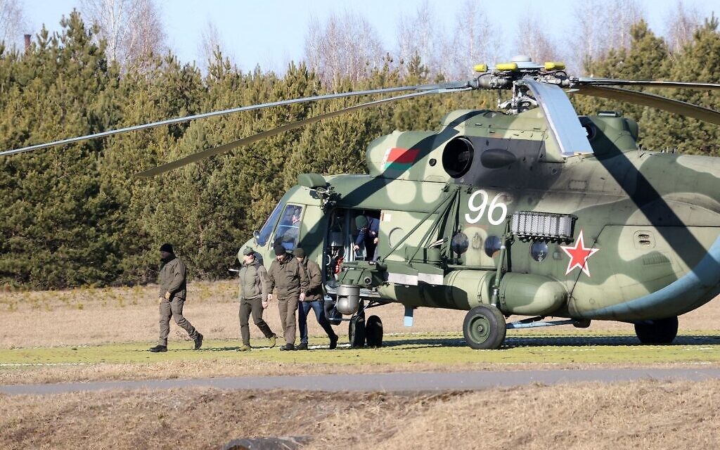 Ukrainian Defense Minister Oleksii Reznikov (2L) arrives to attend the talks between delegations from Ukraine and Russia in Belarus' Gomel region on February 28, 2022. (Sergei KHOLODILIN / BELTA / AFP)