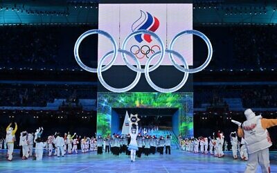The delegation from Russia takes part in the parade of athletes, underneath the Olympics rings, during the opening ceremony of the Beijing 2022 Winter Olympic Games, at the National Stadium, known as the Bird's Nest, in Beijing, on February 4, 2022. (Ben STANSALL / AFP)