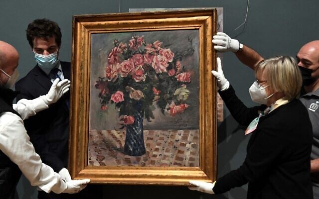 Belgian State Secretary for Scientific Policy, Recovery Program and Strategic Investments Thomas Dermine (left) and the lawyer of the Mayer family Imke Gielen (right) hold 'Blumenstilleben' ('Flowers'), at the Belgium Royal Museums of Fine-Arts in Brussels, on February 10, 2022. (John Thys/AFP) Belgian State Secretary for Scientific Policy, Recovery Program and Strategic Investments Thomas Dermine (left) and the lawyer of the Mayer family Imke Gielen (right) hold 'Blumenstilleben' ('Flowers'), at the Belgium Royal Museums of Fine-Arts in Brussels, on February 10, 2022. (John Thys/AFP)