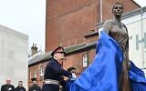 Britain's Lord-Lieutenant Hampshire Nigel Atkinson unveils the statue of Licoricia of Winchester at The Arc, in Winchester, Hampshire, on February 10, 2022. (JUSTIN TALLIS / POOL / AFP)