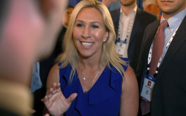 Rep. Marjorie Taylor Greene (Republican of Georgia) is escorted through a throng of media at the Conservative Political Action Conference (CPAC) at The Rosen Shingle Creek on February 26, 2022 in Orlando, Florida. (JOE RAEDLE / Getty Images via AFP) Rep. Marjorie Taylor Greene (Republican of Georgia) is escorted through a throng of media at the Conservative Political Action Conference (CPAC) at The Rosen Shingle Creek on February 26, 2022 in Orlando, Florida. (JOE RAEDLE / Getty Images via AFP)