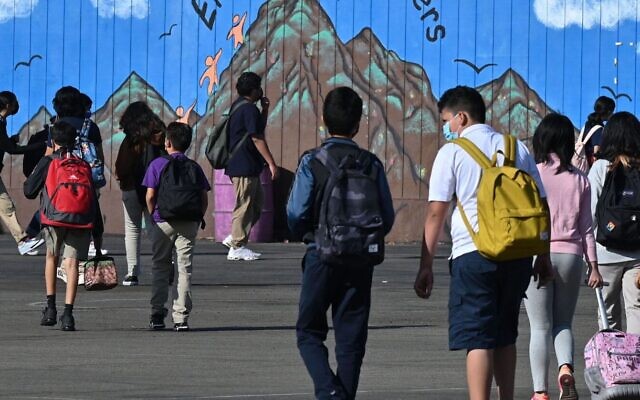 Illustrative: Students walk to their classrooms at a public middle school in Los Angeles, California, Sept. 10, 2021. (Robyn Beck/AFP/Getty Images via JTA) Illustrative: Students walk to their classrooms at a public middle school in Los Angeles, California, Sept. 10, 2021. (Robyn Beck/AFP/Getty Images via JTA)