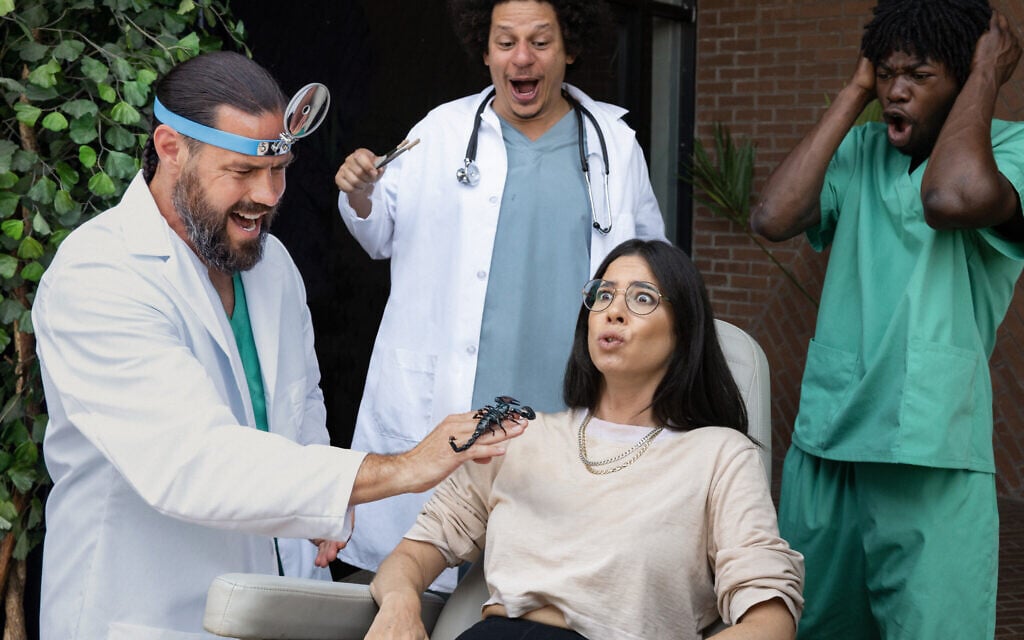 Rachel Wolfson in an uncomfortable scene with, from left, Chris Pontius, Eric Andre, and Eric Manaka — and a scorpion — in 'Jackass: Forever.' (Paramount Pictures)