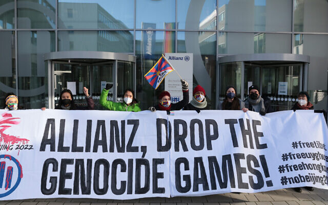 Members of Never Again Right Now protest at Allianz headquarters in Berlin, Jan. 21, 2022. (Tibet Initiative Germany via JTA)
