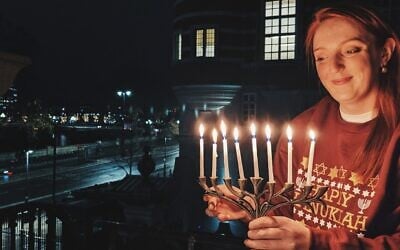 Charlotte Nichols, the British Labour Party's parliament representative for Warrington North, lights a Hanukkah menorah. (Courtesy of Nichols)