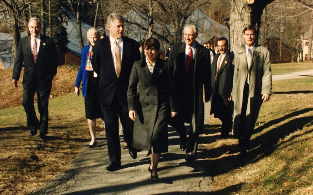 Marjorie Margolies, front center, walks with former US president Bill Clinton and others in this undated photo. (Courtesy)