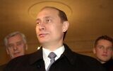 In this file photo taken on Sunday, March 26, 2000, Acting Russian President and Presidential candidate Vladimir Putin talks with representatives of the news media at a polling station in Moscow, Russia (AP Photo/ Alexander Zemlianichenko, file)