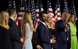 From left, Ivanka Trump, Eric and Lara Trump, Kimberly Guilfoyle and Donald Trump Jr., Tiffany Trump, President Donald Trump and first lady Melania Trump and Barron Trump stand on stage on the South Lawn of the White House on the fourth day of the Republican National Convention, Thursday, Aug. 27, 2020, in Washington. (AP Photo/Alex Brandon)