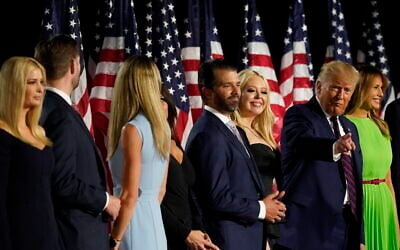 From left, Ivanka Trump, Eric and Lara Trump, Kimberly Guilfoyle and Donald Trump Jr., Tiffany Trump, President Donald Trump and first lady Melania Trump and Barron Trump stand on stage on the South Lawn of the White House on the fourth day of the Republican National Convention, Thursday, Aug. 27, 2020, in Washington. (AP Photo/Alex Brandon)