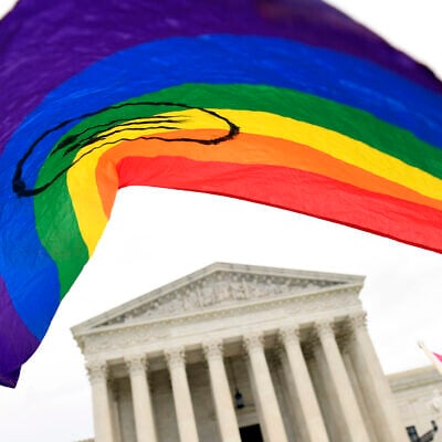 FILE - In this Oct. 8, 2019, file photo, protesters gather outside the Supreme Court in Washington. Legislation that would create new protections for LGBTQ Americans is stalling out in the US Senate. (AP/Susan Walsh)