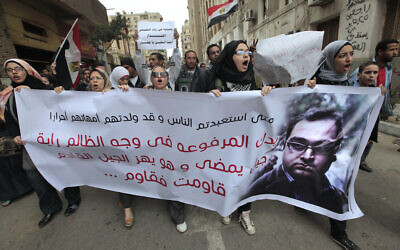 Egyptian protesters shout slogans against the then ruling military council during a rally in support of then member of Parliament Zyad el-Elaimy outside the Egyptian parliament in Cairo, Egypt, on February 21, 2012. (AP/Amr Nabil, File)