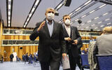 Mohammad Eslami, head of Iran's nuclear agency (left), and Iran's Governor to the International Atomic Energy Agency, Kazem Gharib Abadi, leave the International Atomic Energy's General Conference in Vienna, Austria, on Monday, September 20, 2021. (AP Photo/Lisa Leutner, File)