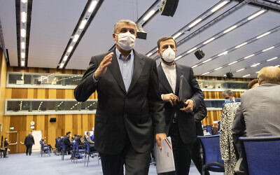 Mohammad Eslami, head of Iran's nuclear agency (left), and Iran's Governor to the International Atomic Energy Agency, Kazem Gharib Abadi, leave the International Atomic Energy's General Conference in Vienna, Austria, on Monday, September 20, 2021. (AP Photo/Lisa Leutner, File)