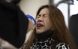 A woman takes a PCR coronavirus test at a private nursing home in Netanya. (AP Photo/Ariel Schalit)