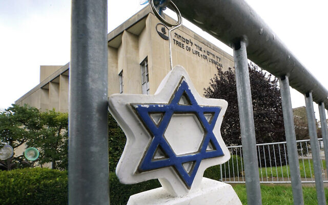 A Star of David hangs from a fence outside the dormant landmark Tree of Life synagogue in Pittsburgh's Squirrel Hill neighborhood on Tuesday, Oct. 26, 2021. (AP Photo/Gene J. Puskar, File) A Star of David hangs from a fence outside the dormant landmark Tree of Life synagogue in Pittsburgh's Squirrel Hill neighborhood on Tuesday, Oct. 26, 2021. (AP Photo/Gene J. Puskar, File)