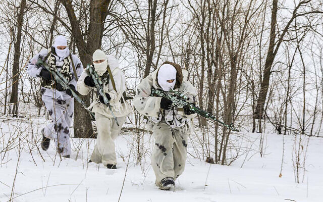 In this photo released by the Russian Defense Ministry Press Service on Tuesday, Feb. 1, 2022, snipers change their position during a military exercise in the Nizhny Novgorod Region, Russia. (Russian Defense Ministry Press Service via AP) In this photo released by the Russian Defense Ministry Press Service on Tuesday, Feb. 1, 2022, snipers change their position during a military exercise in the Nizhny Novgorod Region, Russia. (Russian Defense Ministry Press Service via AP)