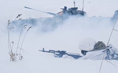 In this photo taken from video and released by the Russian Defense Ministry Press Service on February 2, 2022, Russian soldiers attend a military training at the Yurginsky training ground in the Kemerovo region, Russia. (Russian Defense Ministry Press Service via AP)